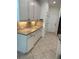 Kitchen boasts granite countertops, backsplash, and white cabinetry, with tile flooring at 1812 Leather Fern Dr, Ocoee, FL 34761