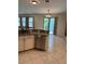 Updated kitchen featuring stainless steel appliances, granite counters, and tile flooring at 1812 Leather Fern Dr, Ocoee, FL 34761