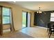 Spacious living room featuring large windows and modern light fixture at 1812 Leather Fern Dr, Ocoee, FL 34761