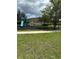 Playground with slides and swings on a grassy lot at 1812 Leather Fern Dr, Ocoee, FL 34761