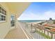 Enjoy ocean views from this tiled balcony, overlooking a pool and beach at 1900 N Atlantic Ave # 504, Daytona Beach, FL 32118