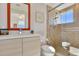 Bright bathroom featuring a walk-in shower and modern vanity at 1900 N Atlantic Ave # 504, Daytona Beach, FL 32118