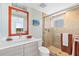 Modern bathroom featuring a glass shower, stylish vanity, and neutral finishes at 1900 N Atlantic Ave # 504, Daytona Beach, FL 32118