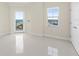 Large room features a window with a view, and a door to the outside at 1900 N Atlantic Ave # 504, Daytona Beach, FL 32118