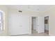 Bright bedroom featuring double closets, neutral walls, and tile flooring at 1900 N Atlantic Ave # 504, Daytona Beach, FL 32118
