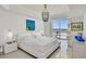 Bright bedroom with ocean views and an elegant chandelier at 1900 N Atlantic Ave # 504, Daytona Beach, FL 32118