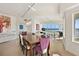 Dining room with modern chandelier and ocean view is great for entertaining at 1900 N Atlantic Ave # 504, Daytona Beach, FL 32118