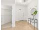Bright entryway with modern light fixture, and closet for storage at 1900 N Atlantic Ave # 504, Daytona Beach, FL 32118