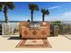 Outdoor grilling area featuring a built-in grill, tile accents, and ocean views, perfect for entertaining at 1900 N Atlantic Ave # 504, Daytona Beach, FL 32118