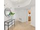 Inviting hallway with tile floor, recessed lighting, and decorative mirror at 1900 N Atlantic Ave # 504, Daytona Beach, FL 32118