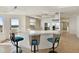Bright kitchen area with bar seating, modern cabinets, and stainless appliances at 1900 N Atlantic Ave # 504, Daytona Beach, FL 32118