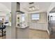 Bright kitchen with white cabinets, stainless steel appliances, and an island with bar seating at 1900 N Atlantic Ave # 504, Daytona Beach, FL 32118