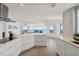 Modern kitchen with stainless steel appliances, an island, and access to ocean views at 1900 N Atlantic Ave # 504, Daytona Beach, FL 32118