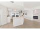 Modern white kitchen with stainless steel appliances, stone accents and an island at 1900 N Atlantic Ave # 504, Daytona Beach, FL 32118