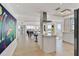 Open-concept kitchen with an island that flows into the dining area with ocean views at 1900 N Atlantic Ave # 504, Daytona Beach, FL 32118