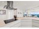 Modern kitchen featuring stainless steel appliances, cooktop, and ocean views at 1900 N Atlantic Ave # 504, Daytona Beach, FL 32118