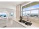Modern kitchen with a stainless steel sink and a view overlooking the ocean at 1900 N Atlantic Ave # 504, Daytona Beach, FL 32118