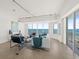 Open-concept living space with ocean view and modern furnishings, light colored walls and tile flooring at 1900 N Atlantic Ave # 504, Daytona Beach, FL 32118
