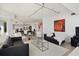 Open living room with bright light, modern furniture, and view of the kitchen at 1900 N Atlantic Ave # 504, Daytona Beach, FL 32118
