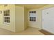 Inviting outdoor patio area with windows and unit number at 1900 N Atlantic Ave # 504, Daytona Beach, FL 32118