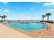 Beachfront community pool with chairs, beach access and well maintained patio area with tropical landscaping at 1900 N Atlantic Ave # 504, Daytona Beach, FL 32118