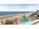 View of the pool, beach, and ocean from the balcony at 1900 N Atlantic Ave # 504, Daytona Beach, FL 32118
