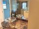 Bathroom with glass vessel sinks atop dark marble countertop and decorative mirror at 1990 Spruce Creek N Cir, Port Orange, FL 32128