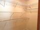 Walk-in closet with white wire shelving for optimal storage at 1990 Spruce Creek N Cir, Port Orange, FL 32128