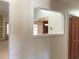 Interior shot offers a glimpse into the kitchen and living area at 1990 Spruce Creek N Cir, Port Orange, FL 32128