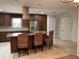 Bright kitchen with a center island, stainless steel refrigerator, and custom cabinetry at 1990 Spruce Creek N Cir, Port Orange, FL 32128