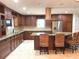 Spacious kitchen featuring custom cabinets, stainless steel appliances, and a center island with seating at 1990 Spruce Creek N Cir, Port Orange, FL 32128