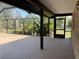 Spacious screened porch with views of the landscaped backyard, perfect for outdoor relaxation and entertaining at 1990 Spruce Creek N Cir, Port Orange, FL 32128
