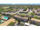 Aerial view of a well-maintained community with a pool and mature landscaping at 200 Saint Andrews Blvd # 2804, Winter Park, FL 32792