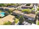 Aerial view showing community with beautiful landscaping, swimming pool, and tennis court at 200 Saint Andrews Blvd # 2804, Winter Park, FL 32792