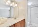 Well lit bathroom with a long counter and access to a shower room at 200 Saint Andrews Blvd # 2804, Winter Park, FL 32792
