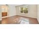 Well-lit room with wood floors and a view into an adjoining bathroom at 200 Saint Andrews Blvd # 2804, Winter Park, FL 32792