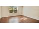 Bedroom with hardwood floors and a large window for ample natural light at 200 Saint Andrews Blvd # 2804, Winter Park, FL 32792