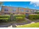 A welcoming multi-Gathering home showcases tidy landscaping with well-manicured shrubs and mature trees at 200 Saint Andrews Blvd # 2804, Winter Park, FL 32792