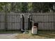 View of the water filtration equipment along the back fence in the backyard of this home at 2044 7Th Ave, Deland, FL 32724