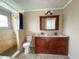 This bathroom features a double vanity, walk in shower, and neutral paint at 2044 7Th Ave, Deland, FL 32724