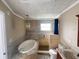 Bright bathroom featuring a soaking tub with marble surround and a walk-in shower with a tiled accent wall at 2044 7Th Ave, Deland, FL 32724