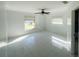 Bright bedroom with tile floors and ample natural light from two windows at 2044 7Th Ave, Deland, FL 32724