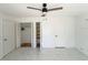 This bedroom features tile flooring, a ceiling fan, and 2 large closets at 2044 7Th Ave, Deland, FL 32724