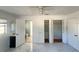 This bedroom features an en suite bathroom, tile flooring, and 2 large closets at 2044 7Th Ave, Deland, FL 32724