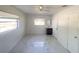 Bright bedroom with modern tile flooring, a ceiling fan, and natural light from a window at 2044 7Th Ave, Deland, FL 32724