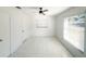 Bright bedroom with a ceiling fan, modern flooring, and natural light from a window at 2044 7Th Ave, Deland, FL 32724