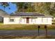 Charming single-story home featuring solar panels and a well-maintained front yard at 2044 7Th Ave, Deland, FL 32724