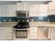 Modern kitchen featuring stainless steel appliances and ample cabinet space at 2044 7Th Ave, Deland, FL 32724