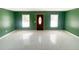 Bright living room featuring large windows and elegant tile floors at 2044 7Th Ave, Deland, FL 32724