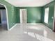 Spacious living room showcasing light-filled windows and modern tile flooring at 2044 7Th Ave, Deland, FL 32724